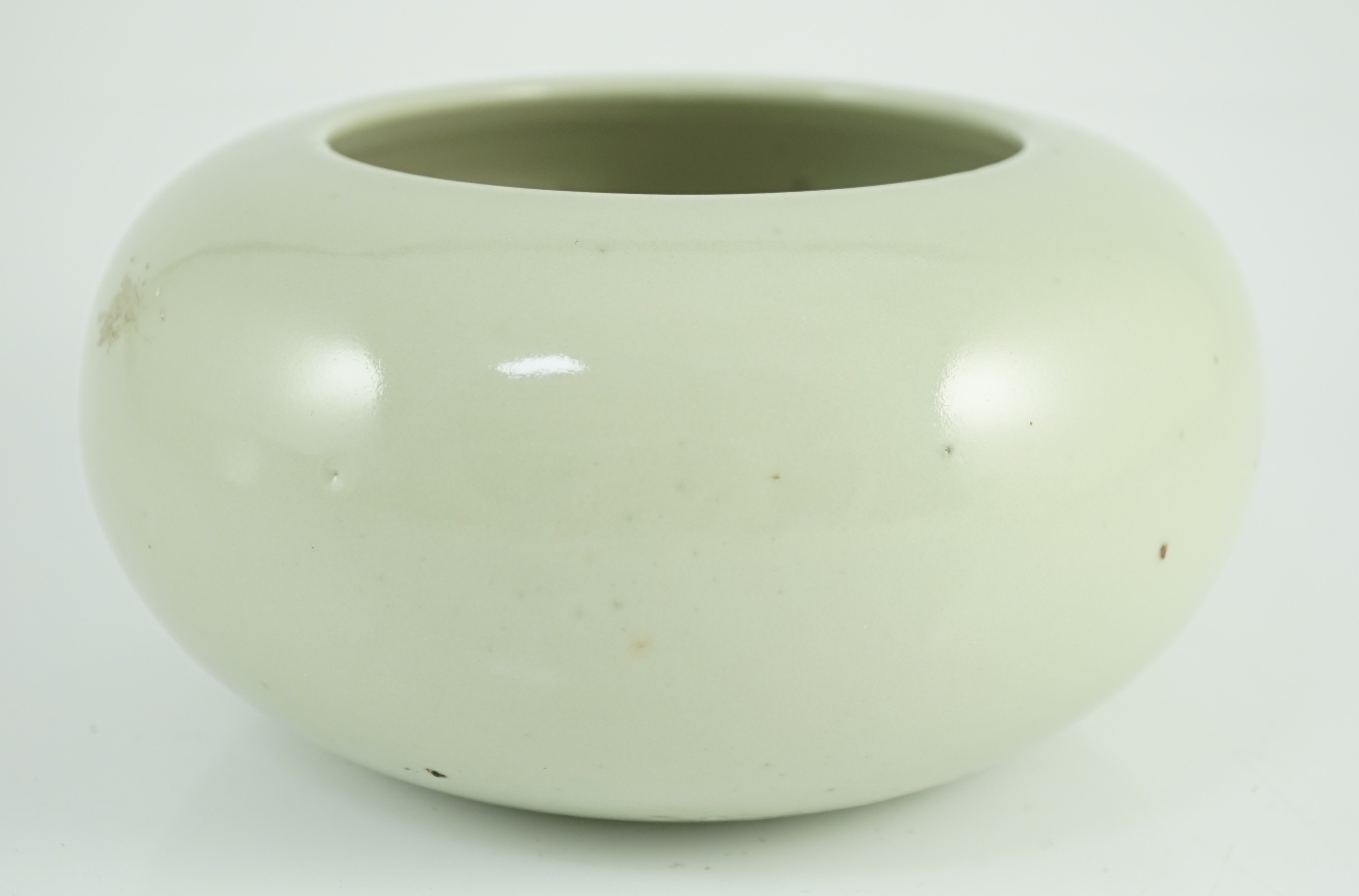 A Chinese celadon glazed water pot or alms bowl, late 19th century, 19cm diameter